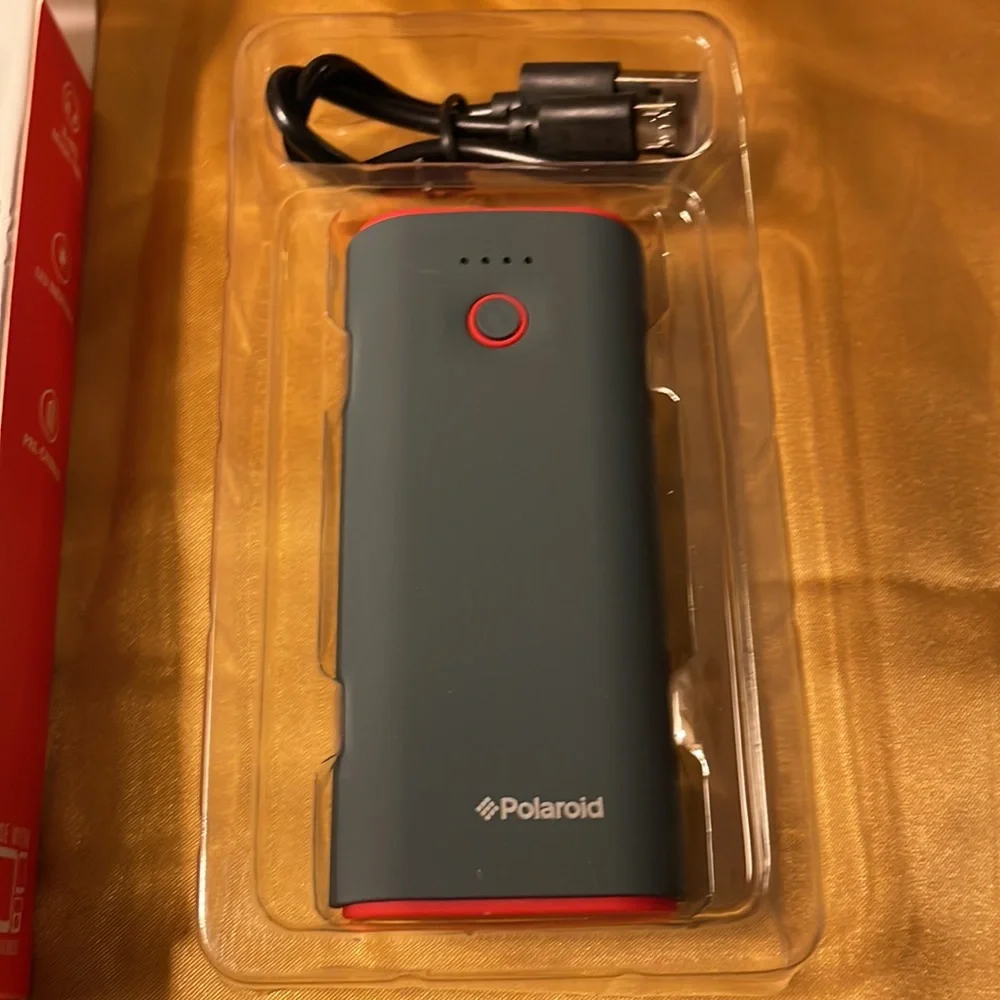 New with tags- Polaroid micro-USB (in) & USB (out), LED indicator, red & black